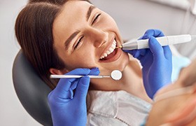 Woman smiles in the dental chair